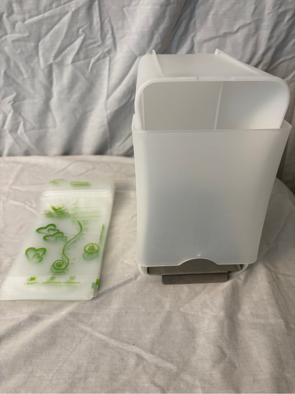 Breast milk freezer dispenser and bags